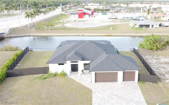 birds eye view of property with a water view