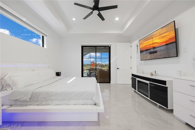 bedroom featuring recessed lighting, ceiling fan, access to exterior, a raised ceiling, and marble finish floor