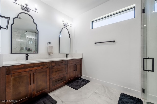 full bathroom with a shower stall, double vanity, baseboards, and a sink