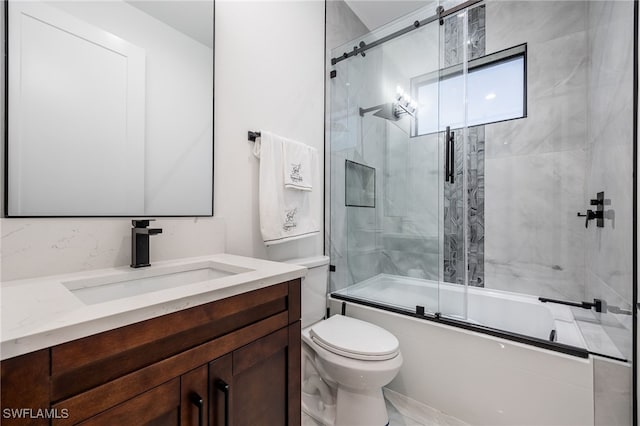 full bath with vanity, toilet, and enclosed tub / shower combo