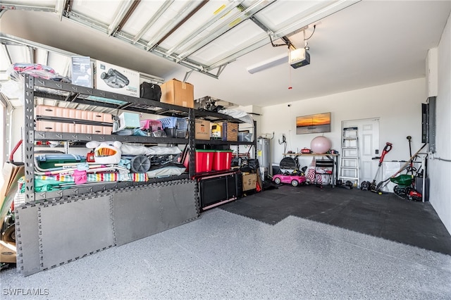 garage featuring gas water heater and a garage door opener