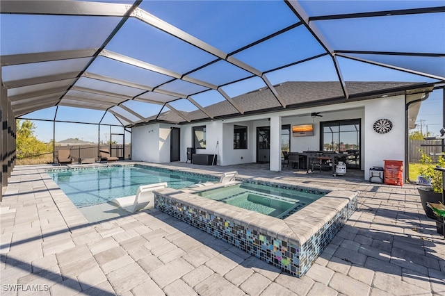 view of pool featuring a patio area, glass enclosure, and fence