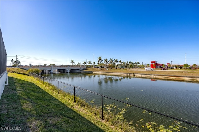 view of water feature with fence