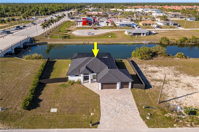 birds eye view of property featuring a water view