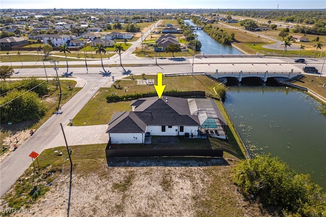 birds eye view of property featuring a water view and a residential view