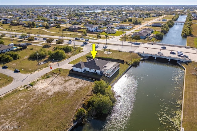 birds eye view of property featuring a residential view and a water view