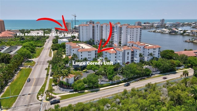 birds eye view of property featuring a water view