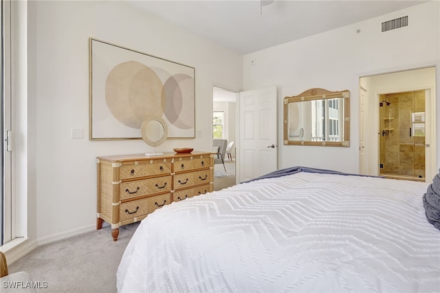 carpeted bedroom featuring connected bathroom