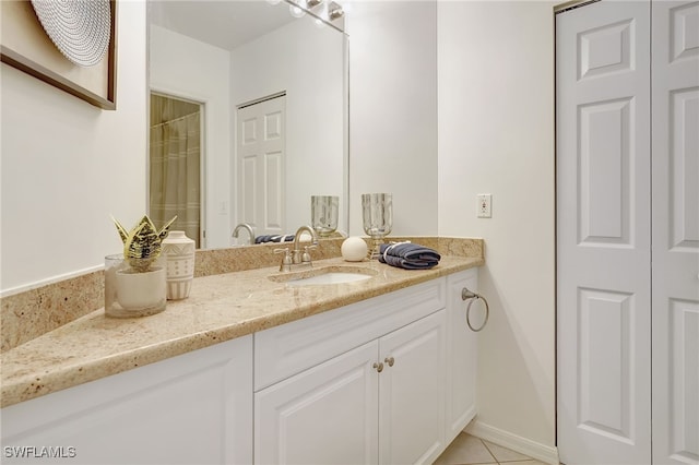 bathroom with vanity and tile patterned floors