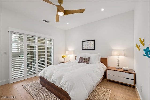 bedroom with light wood-type flooring and ceiling fan