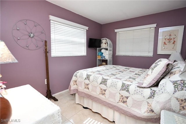 bedroom with light tile patterned floors