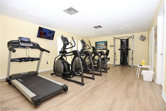 gym featuring light hardwood / wood-style flooring