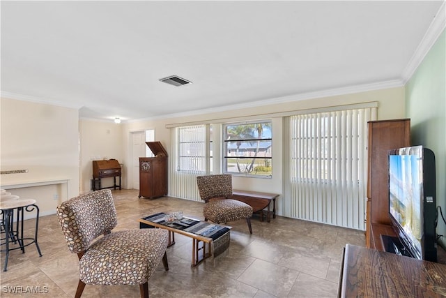 living area with crown molding