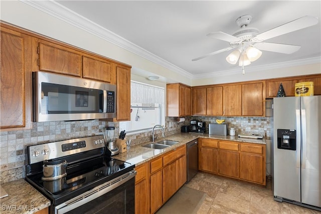 kitchen featuring sink, crown molding, light stone counters, tasteful backsplash, and stainless steel appliances