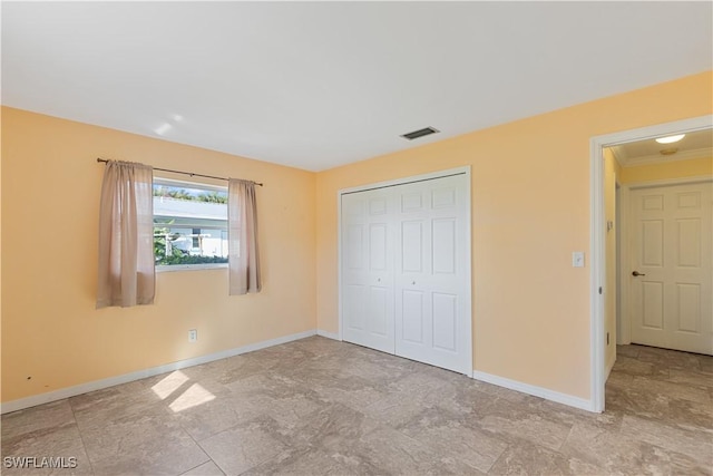 unfurnished bedroom featuring a closet