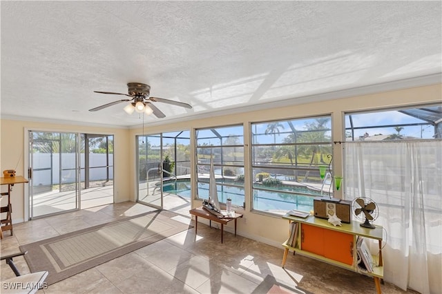 sunroom / solarium with ceiling fan and a wealth of natural light