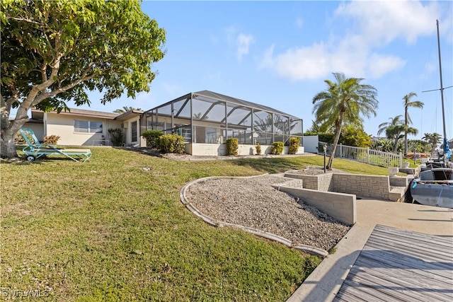 view of yard with glass enclosure