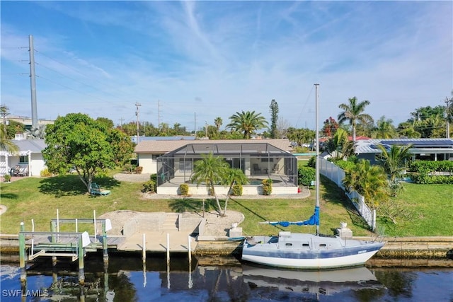 view of dock featuring a water view, a lanai, and a yard