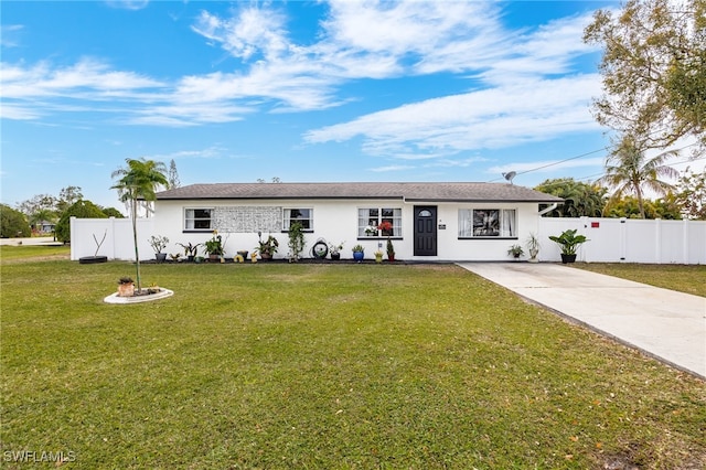 ranch-style home with a front yard