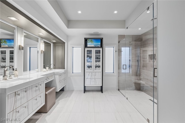 bathroom with tile patterned flooring, vanity, and a shower with shower door