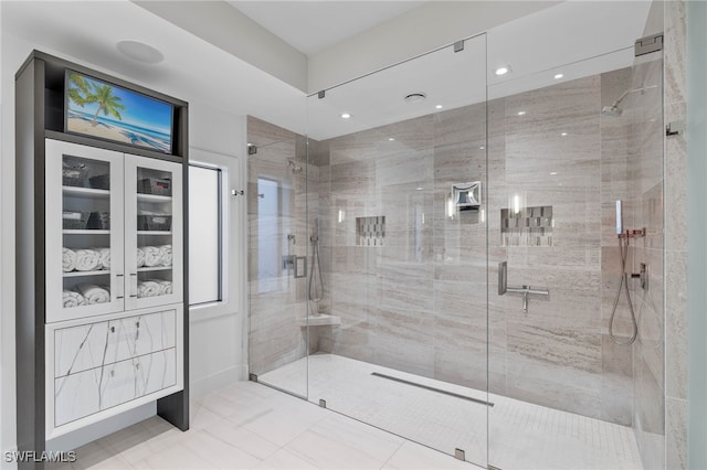 bathroom with a shower with shower door