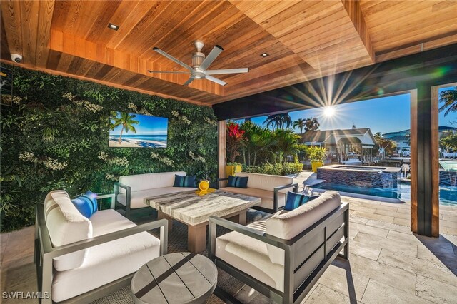 view of patio featuring ceiling fan and an outdoor hangout area