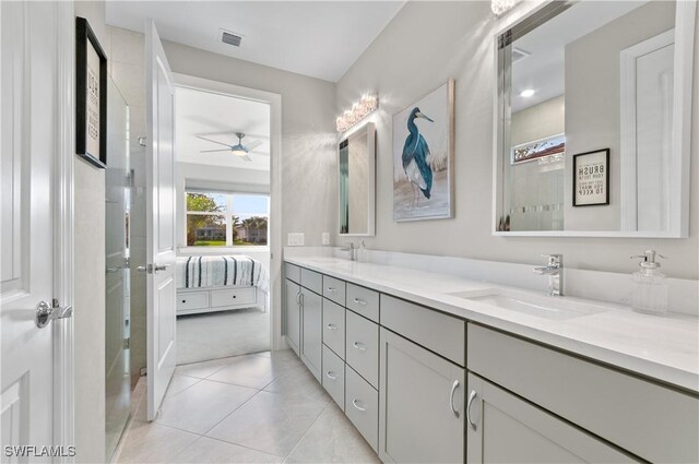 bathroom with ceiling fan, tile patterned flooring, and vanity