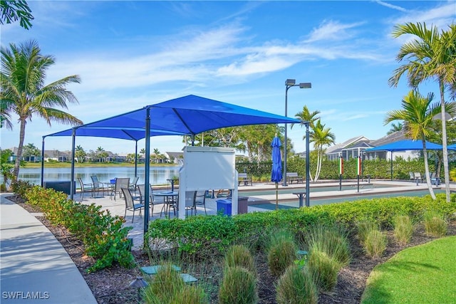 surrounding community featuring a water view