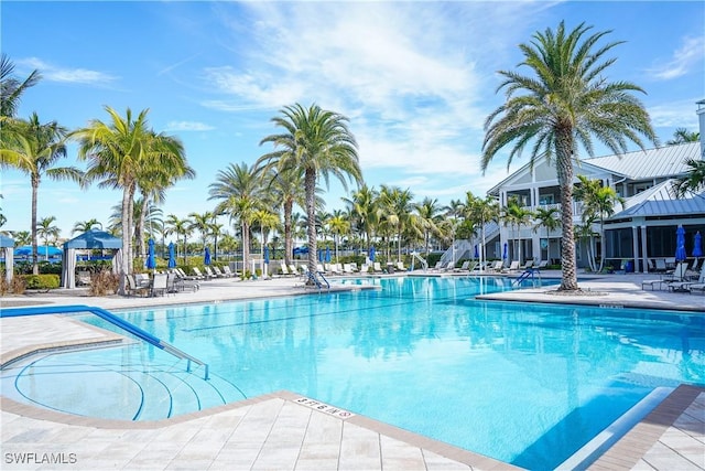 view of swimming pool with a patio area