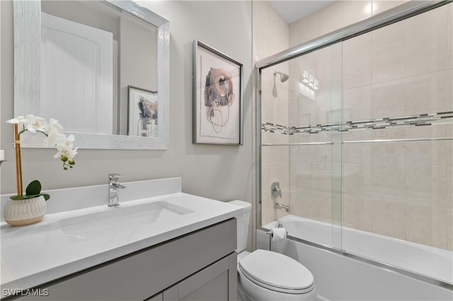 full bathroom featuring vanity, toilet, and enclosed tub / shower combo