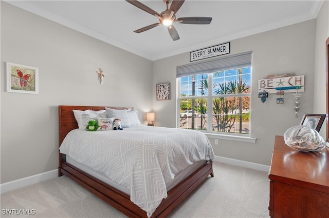 bedroom with ceiling fan, light colored carpet, and crown molding