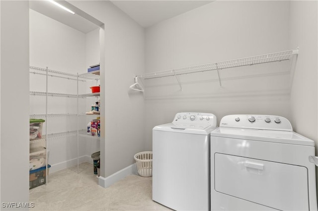 washroom with washing machine and dryer