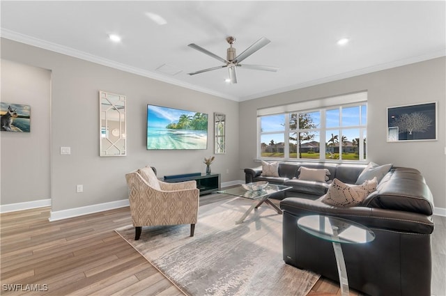 living room featuring ceiling fan, hardwood / wood-style floors, and ornamental molding