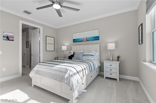 bedroom with ceiling fan, light colored carpet, and crown molding