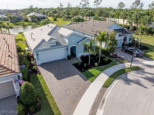 birds eye view of property featuring a water view