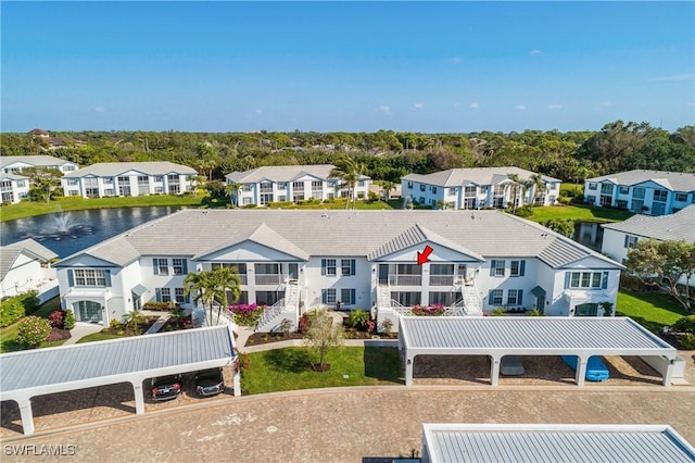 rear view of property featuring a water view