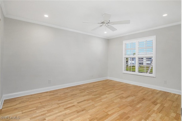 spare room featuring ceiling fan, ornamental molding, and light hardwood / wood-style flooring