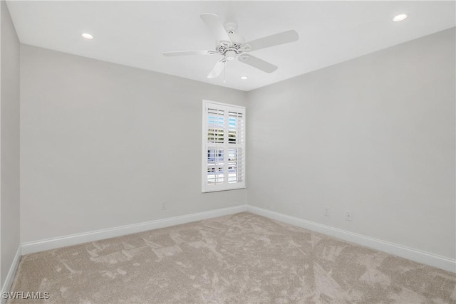 carpeted empty room with ceiling fan