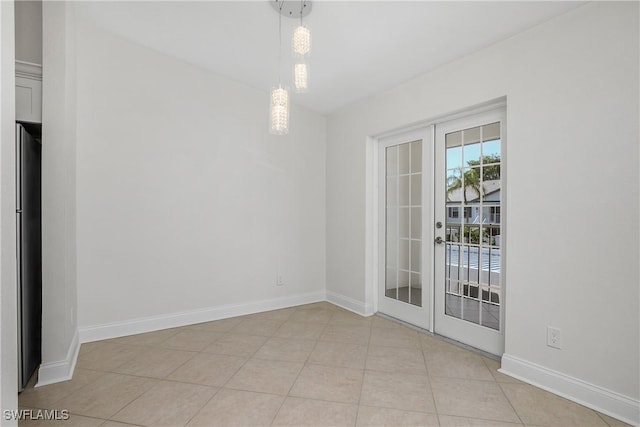 unfurnished room with french doors