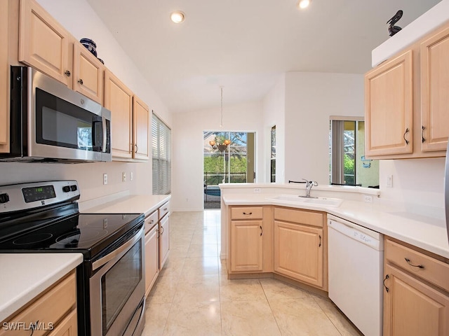 kitchen featuring sink, light brown cabinets, an inviting chandelier, and appliances with stainless steel finishes