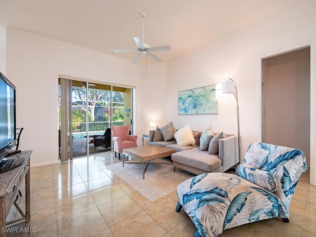 living room with ceiling fan and light tile patterned flooring