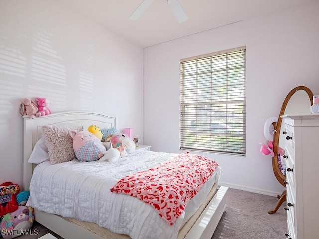 bedroom featuring ceiling fan and light colored carpet