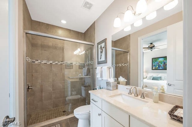 ensuite bathroom featuring toilet, vanity, visible vents, a stall shower, and ensuite bath