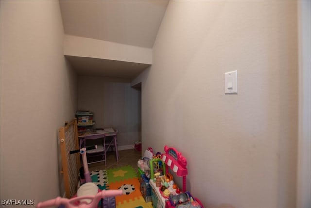 game room with tile patterned floors