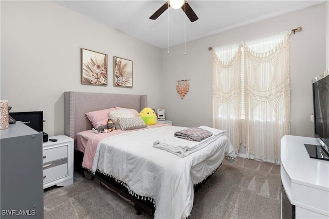 bedroom with ceiling fan and carpet floors