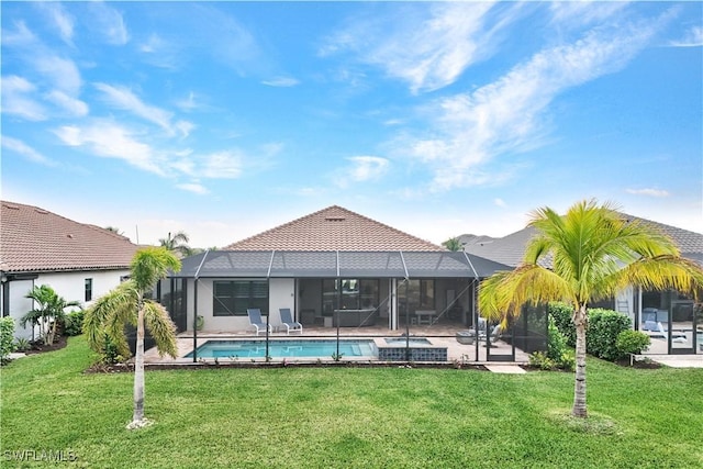 view of swimming pool featuring a lanai and a yard