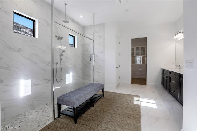 bathroom featuring vanity and a tile shower