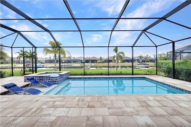 view of pool featuring a patio area, glass enclosure, a water view, and an in ground hot tub