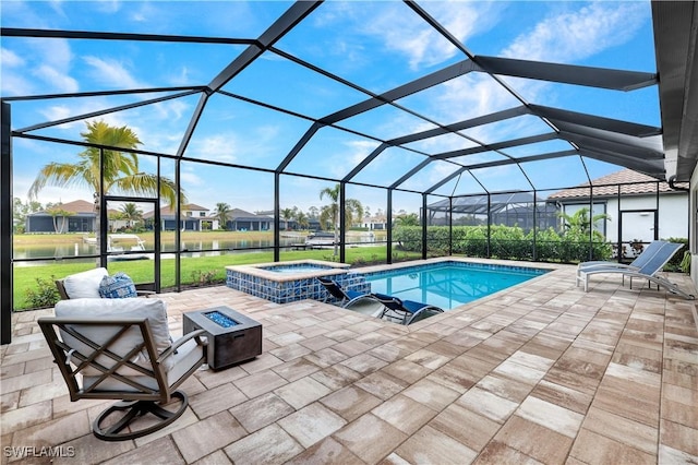 view of swimming pool with glass enclosure, a fire pit, a water view, a patio, and a lawn