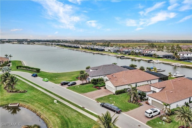 birds eye view of property with a water view